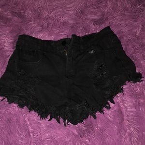 Black distressed shorts.